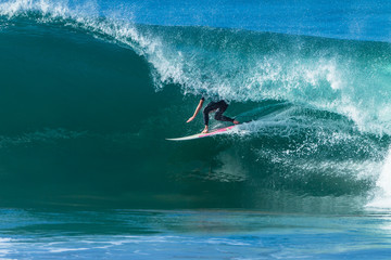 Surfing Surfer Inside Hollow Ocean Wave Tube Ride. - obrazy, fototapety, plakaty