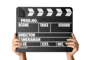 Obraz premium Female hands with clapperboard against white background