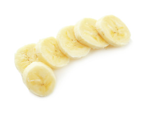 Fototapeta na wymiar Pieces of tasty ripe banana on white background