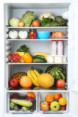 Open fridge full of vegetables and fruits © 5second