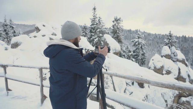 Guy are shooting the mountains. slow motion
