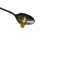 L&ouml;ffel isoliert auf wei&szlig; mit Oil