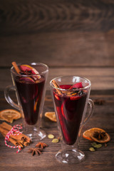 Mulled wine with fruits, cinnamon sticks, anise and decorations