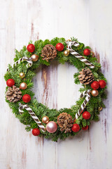 Christmas wreath on a wooden background. Top view. Copy space © virtustudio