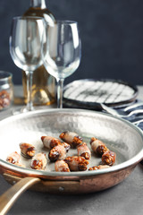 Bacon wrapped dates in frying pan