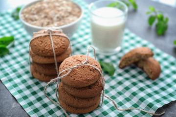 Delicious oatmeal cookies on table