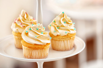 Dessert stand with tasty cupcakes, closeup