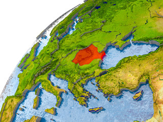 Map of Romania in red on globe