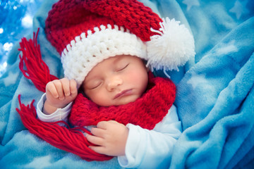Newborn baby sleeping on Christmas eve