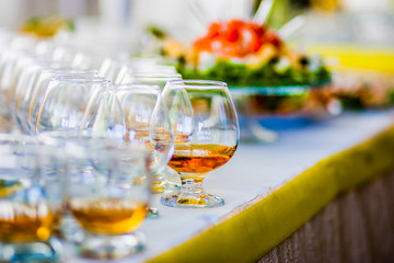 .Glasses of cognac stand on the table