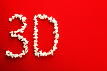 Word 3D made of popcorn on color background