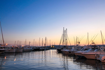 Fototapeta na wymiar Small Yachts Moored in the Harbor of Palamos, Costa Brava, Spain