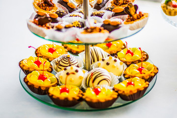 Yellow and chocolate cupcaces on a festive table