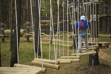 Boy climbing rope