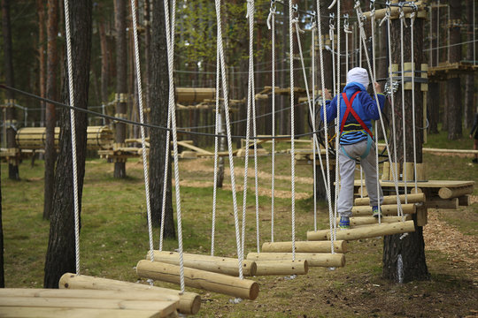 Boy climbing rope