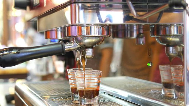 Closeup of tea maker machine during making shots in coffee shop