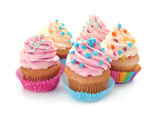 Tasty cupcakes on white background
