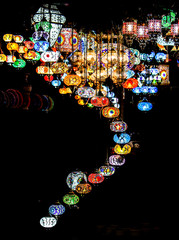 Vibrantly colored Traditional Oriental Lighting Lanterns Hanging from a Ceiling