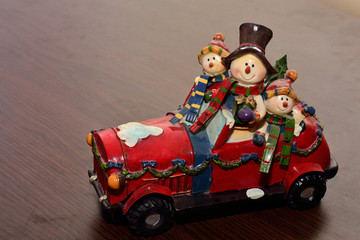 Red toy car with christmas theme 
