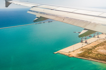The plane approaching the view from the porthole