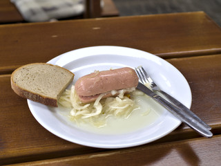 Traditional Czech pub food utopenec on plate.