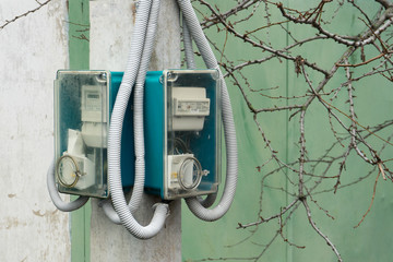 Street counter of consumed electricity. The meter on the pole.