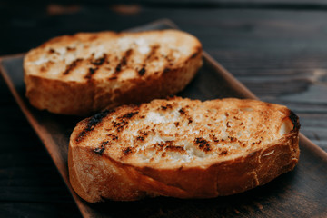 Appetizing crunchy grilled toasts of wheat bread, breakfast concept
