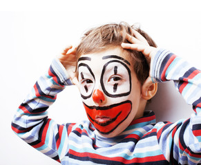 little cute boy with facepaint like clown, pantomimic expression