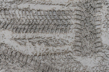 Tire tread of car wheels in the mud.