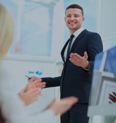 Successful business man at the office leading a group