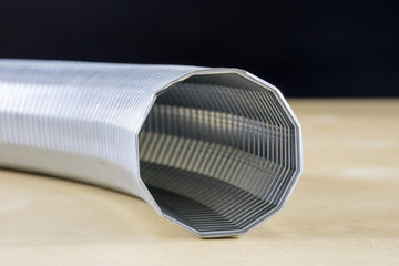 Technical hoses on a wooden table. Cables for use in factories and workshops on a wooden workshop table.