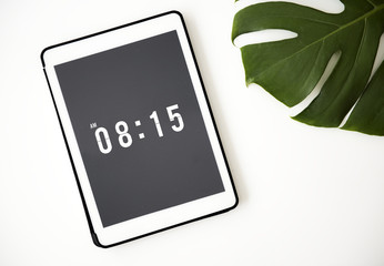 Closeup of digital tablet with time on the screen