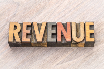 revenue word abstract in wood type