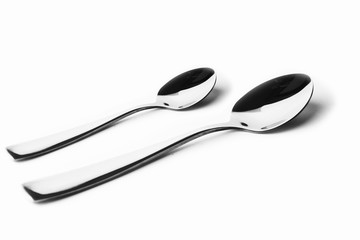 Fork and spoon in white background / A fork, in cutlery or kitchenware , Spoons are used primarily for eating liquid or semi-liquid foods