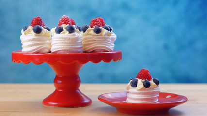 Australian mini pavlovas and flags in red, white and blue for Australia Day or national holiday party food treats.