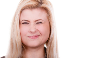 Portrait of happy blonde, charming winking woman