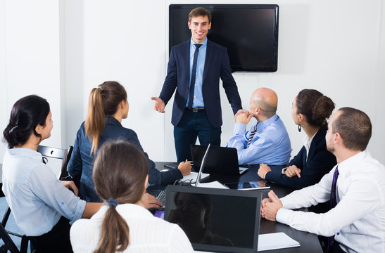 Male manager making presentation in office