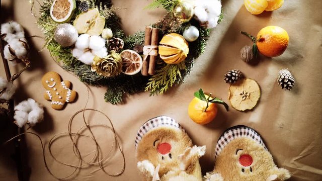 funny slipers on craft background with Christmas wreath ,top view christmas decorate