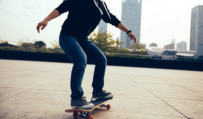 one skateboarder riding with skateboard on city