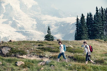 Two women hiking along an alpine trail, Mt Rainier, Washington, America, USA