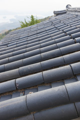 roofing tile, korean traditional national temple at the fall.