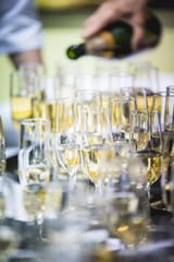Waiters pouring champagne