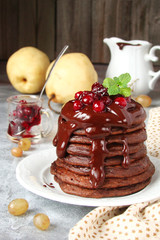 chocolate pancakes with cranberry jam, chocolate and mint