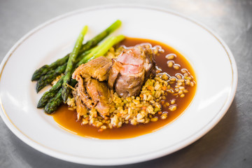 Cooked meat with asparagus