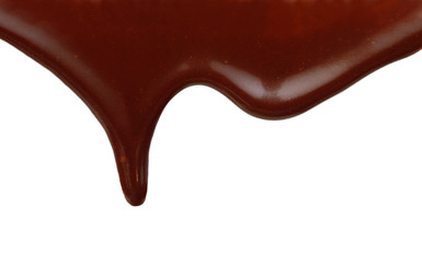 Close up of chocolate syrup leaking on white background