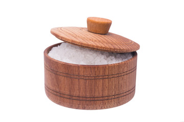 salt in wooden cup with lid, over white background