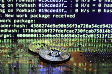 The digital process of cryptocurrency mining by using the GPUs. Bitcoins and video card on a...