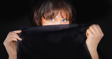 Portrait of young woman with black cloth