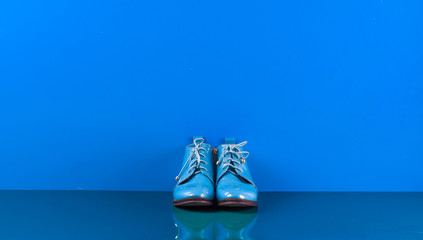 blue female shoes on a blue background