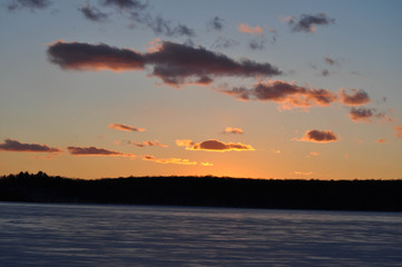 Fototapeta na wymiar Sunset Over a Frozen Lake in Pennsylvania